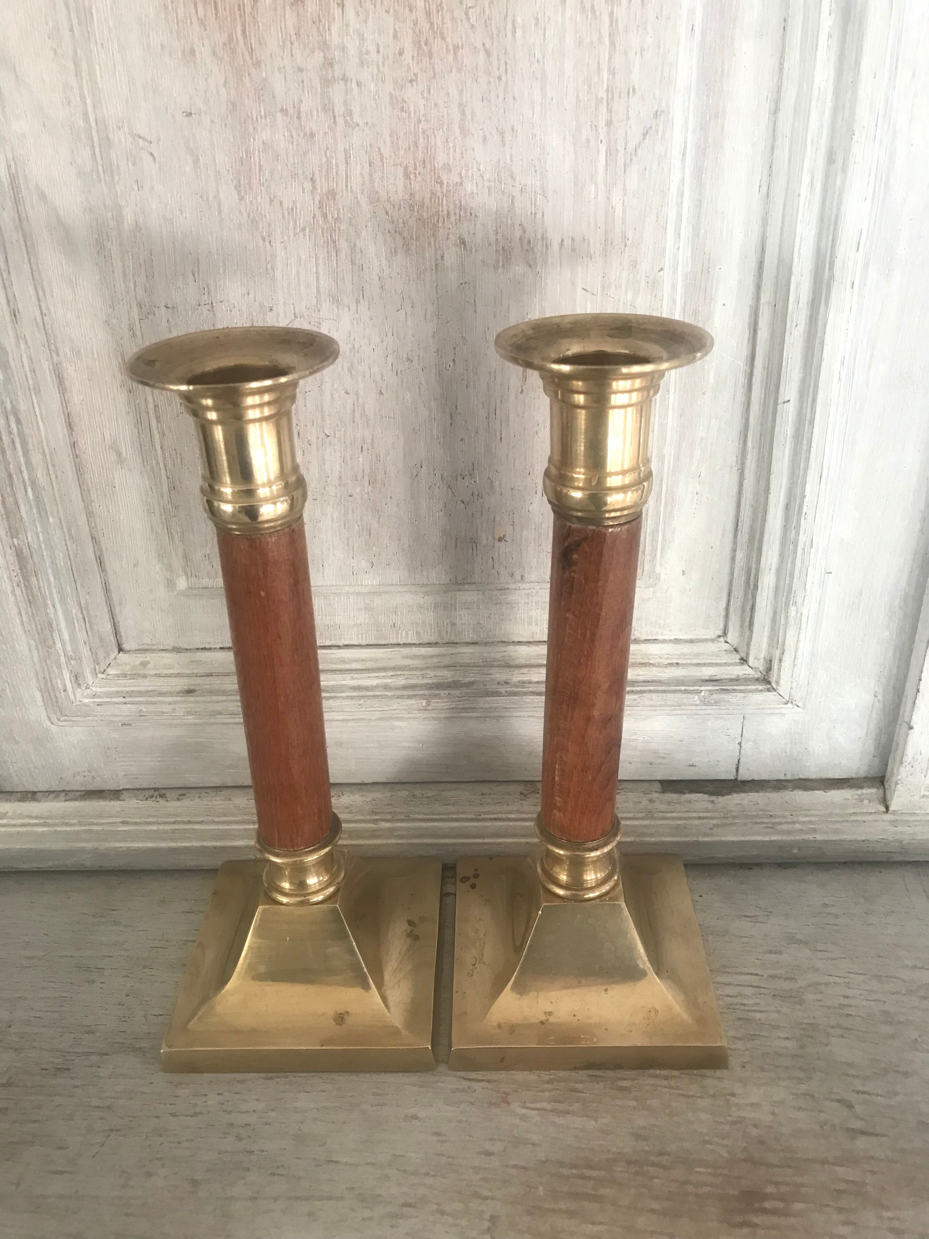 Pair of wood and brass candle holders