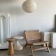 Reclining armchair in natural wood and woven rattan