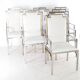 Suite de 6 fauteuils en inox et laiton