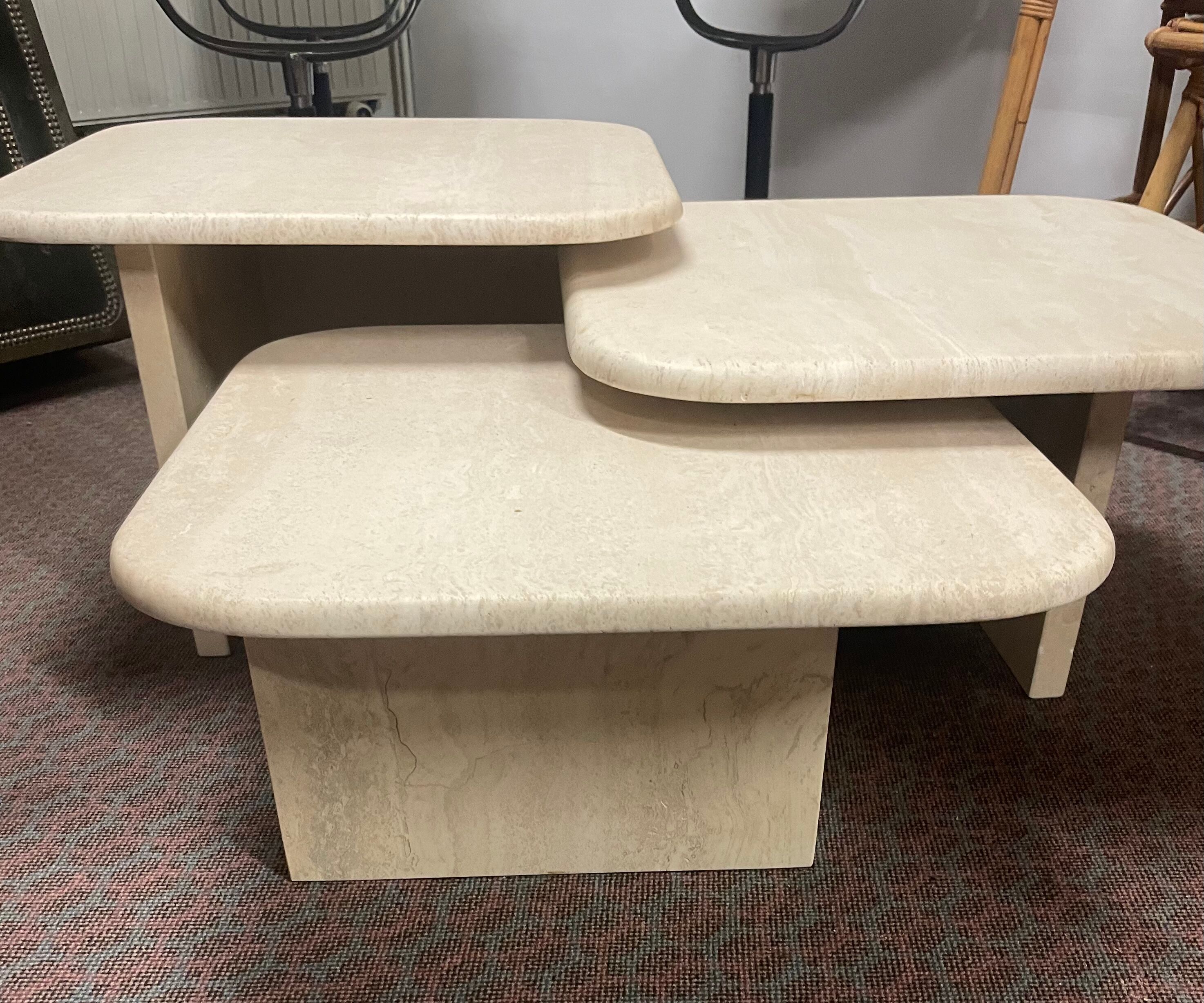 Modular pull-out coffee tables in travertine