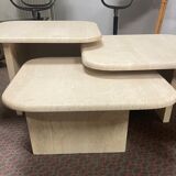 Modular pull-out coffee tables in travertine