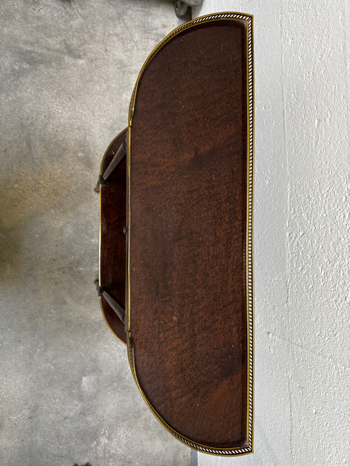 Louis XVI demi-moon console in wood and brass.