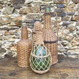 Glass bottles and rattan, woven wicker