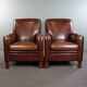 A very beautiful set of 2 Art Deco design armchairs in sheep leather