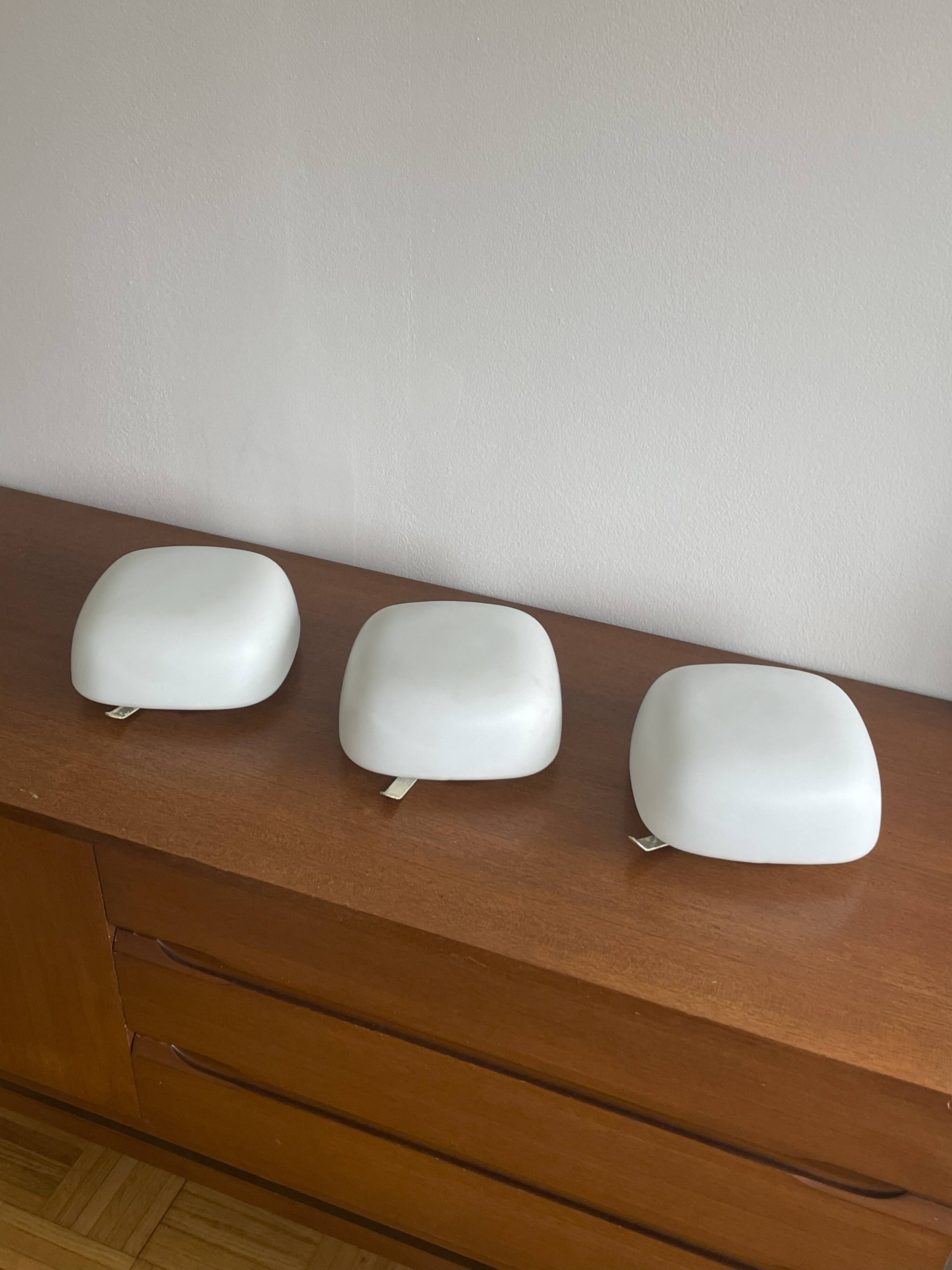 Square wall lights in sandblasted white glass