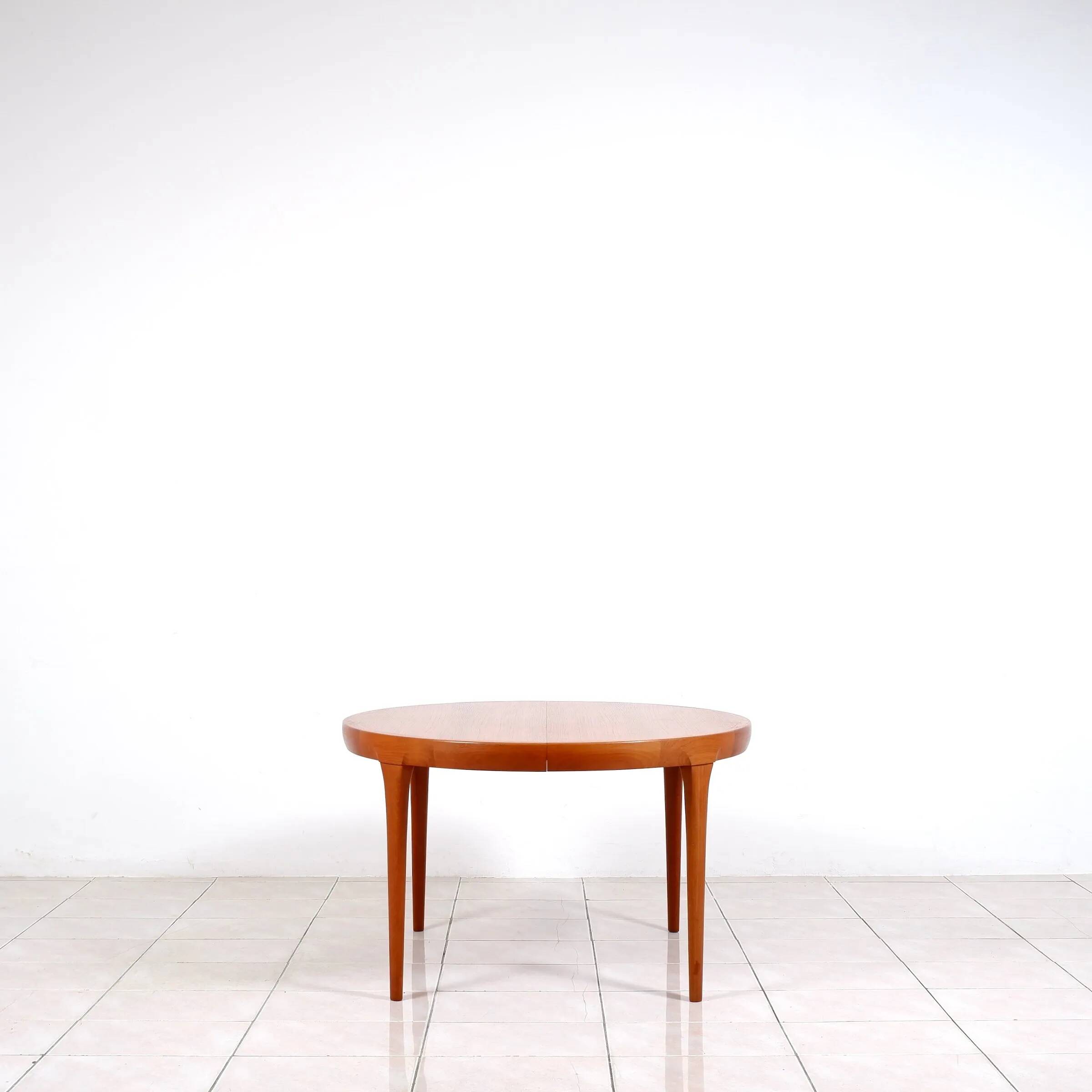 Round dining table in teak by Ib Kofod Larsen for Faarup Mobelfabrik