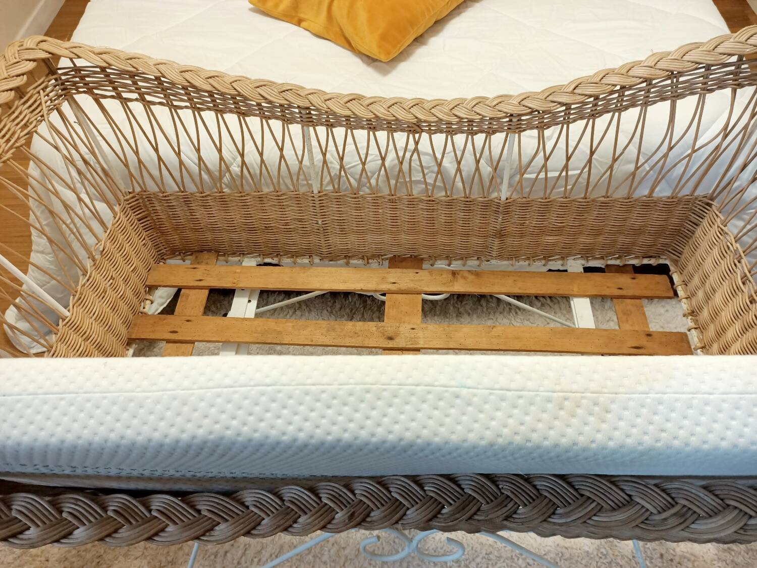 Rattan and wrought iron cradle