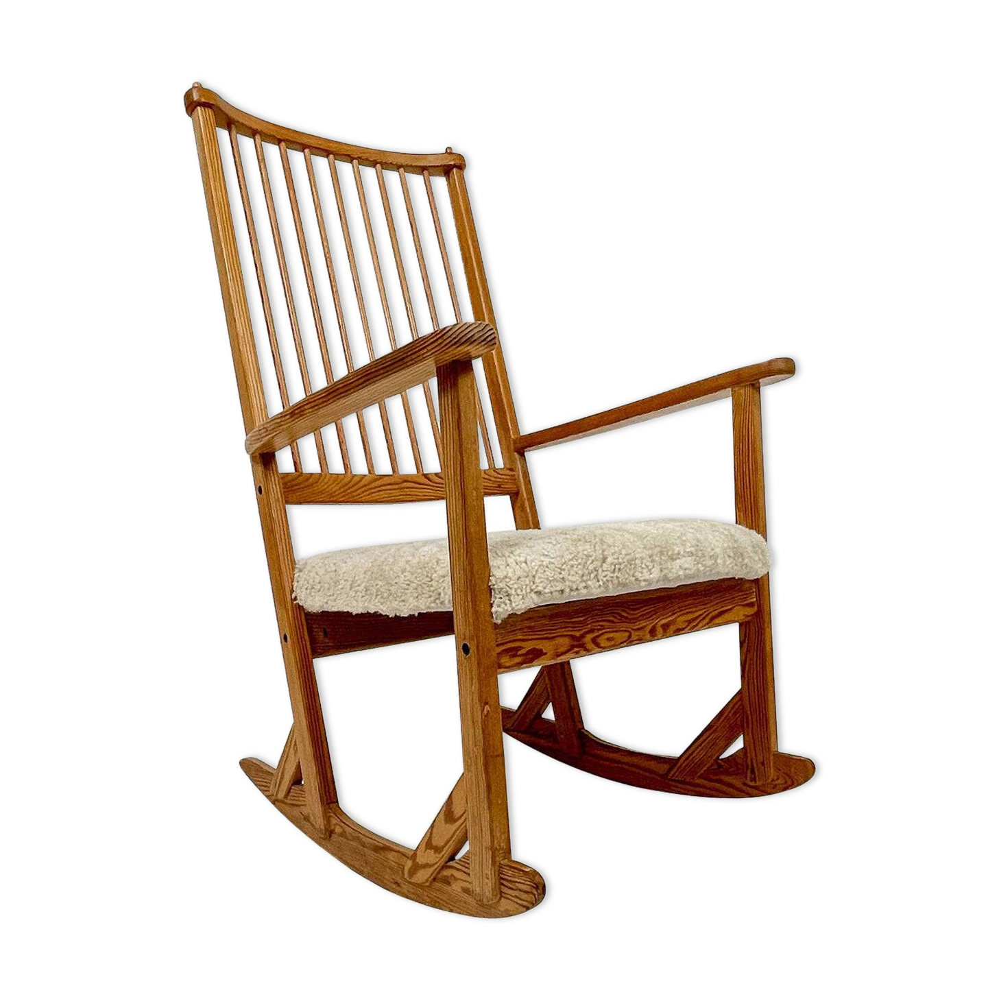 Mid-century rocking chair in pine and sheepskin by Yngve Ekström, Sweden.