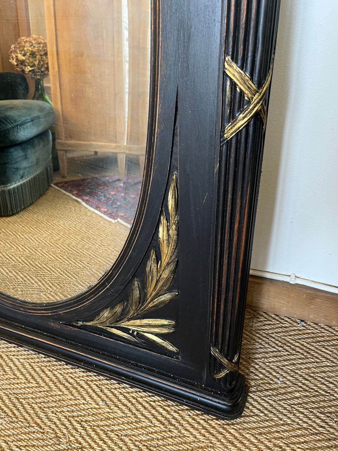 Large old trumeau mirror in black and gilded wood Napoleon style