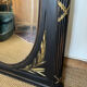 Large old trumeau mirror in black and gilded wood Napoleon style