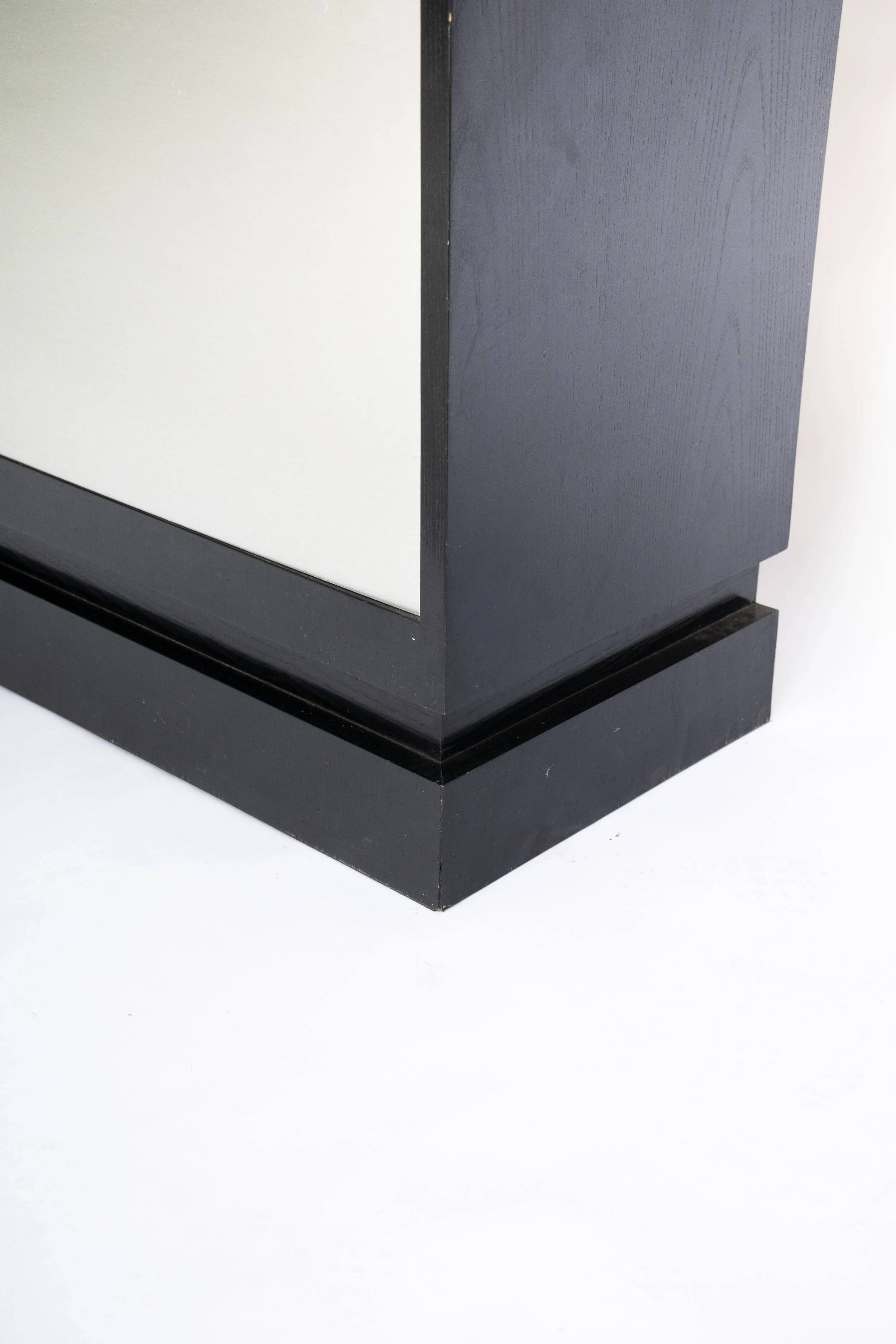 Brushed metal bar cabinet by De Coene