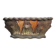 Terracotta planter in a brutalist style resembling a tree trunk, pot cover, countryside.