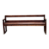 Old wooden bench with backrest and armrests