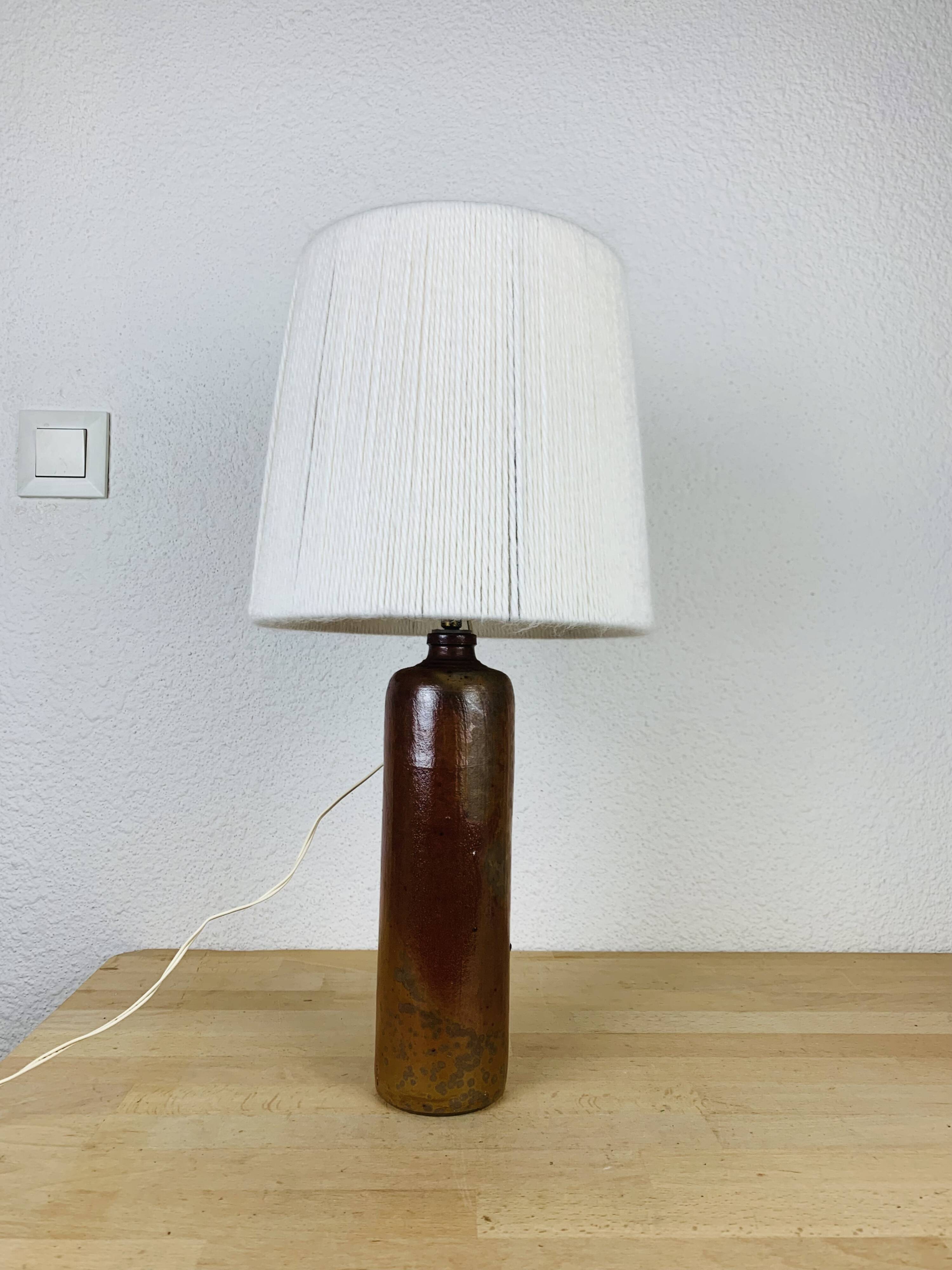 Stoneware bottle lamp and vintage wool lampshade