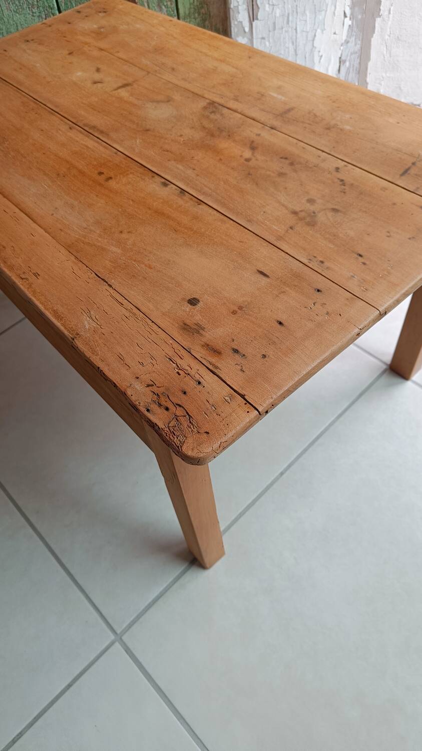 Coffee table with raw wood and a large drawer.