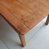 Coffee table with raw wood and a large drawer.