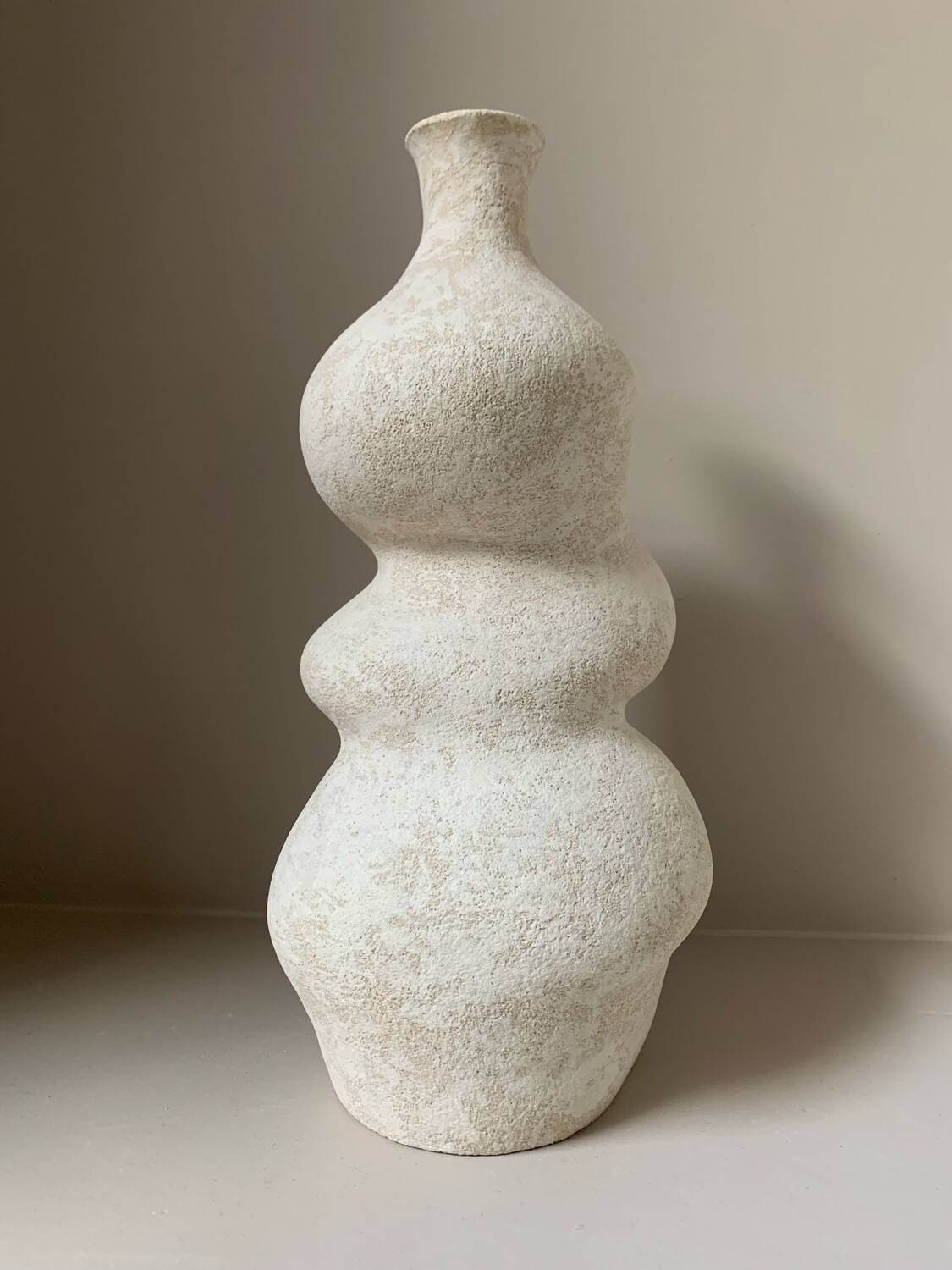 White stoneware vase in an organic shape