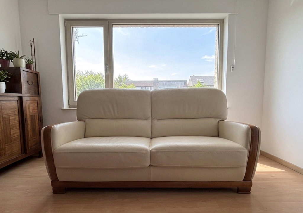 Beige leather sofa with solid wood frame