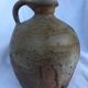 Ancient jug in glazed sandstone