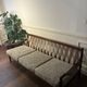 Vintage three-seater sofa — wood and sculptural backrest