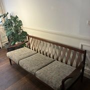 Vintage 3-seater wooden sofa with sculptural backrest.