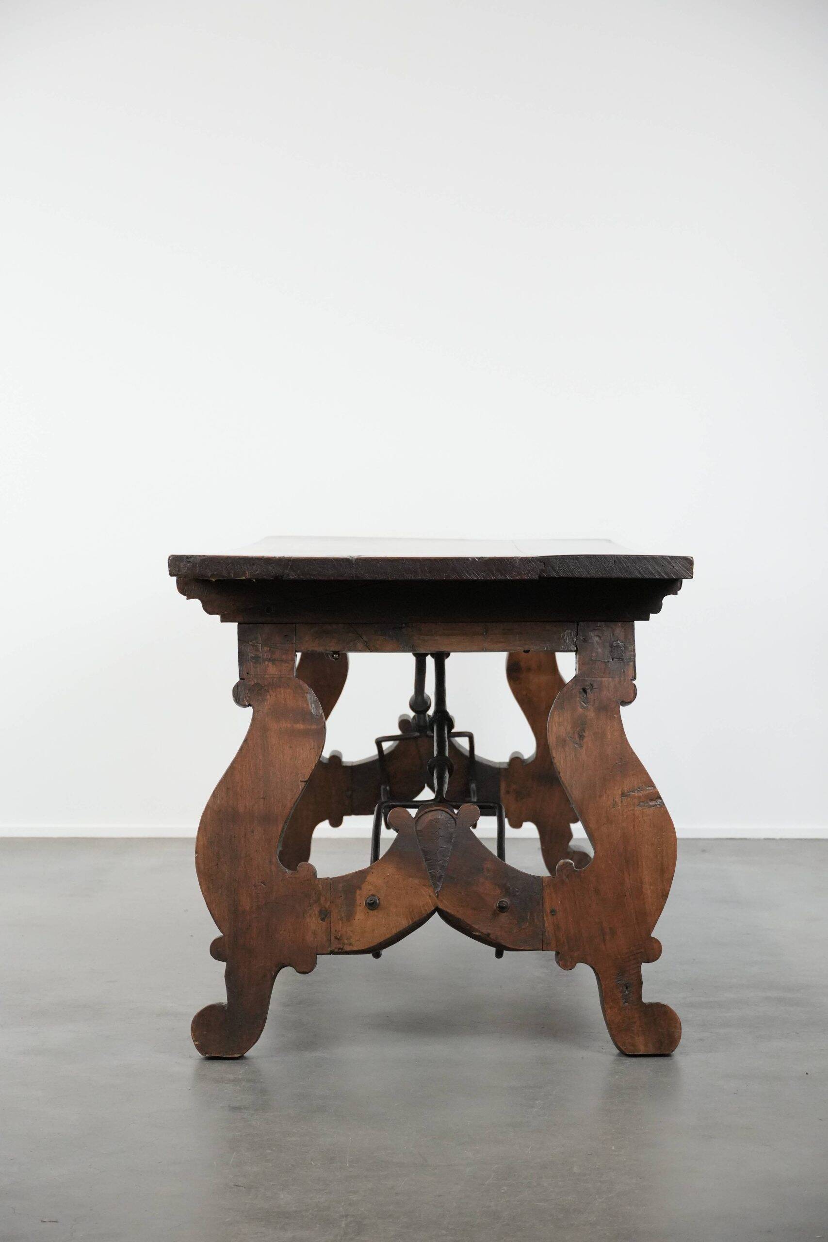 Antique 18th-century Spanish dining table with a wrought iron base