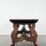 Antique 18th-century Spanish dining table with a wrought iron base