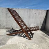 Teak lounge chair with foldable slats