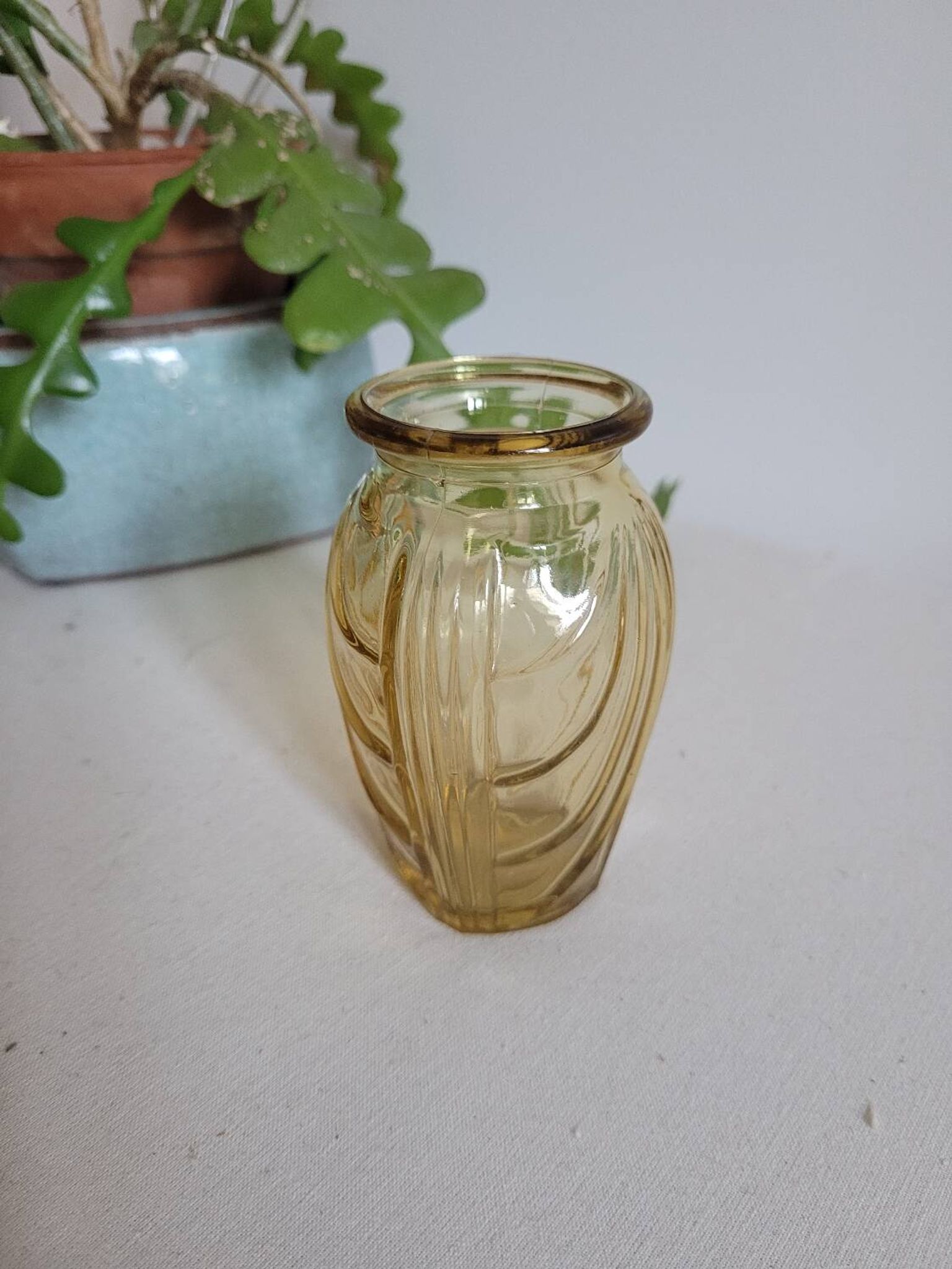 Small yellow draped bulb vase