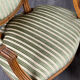 Pair of Louis XVI style armchairs in striped green fabric, 20th century.