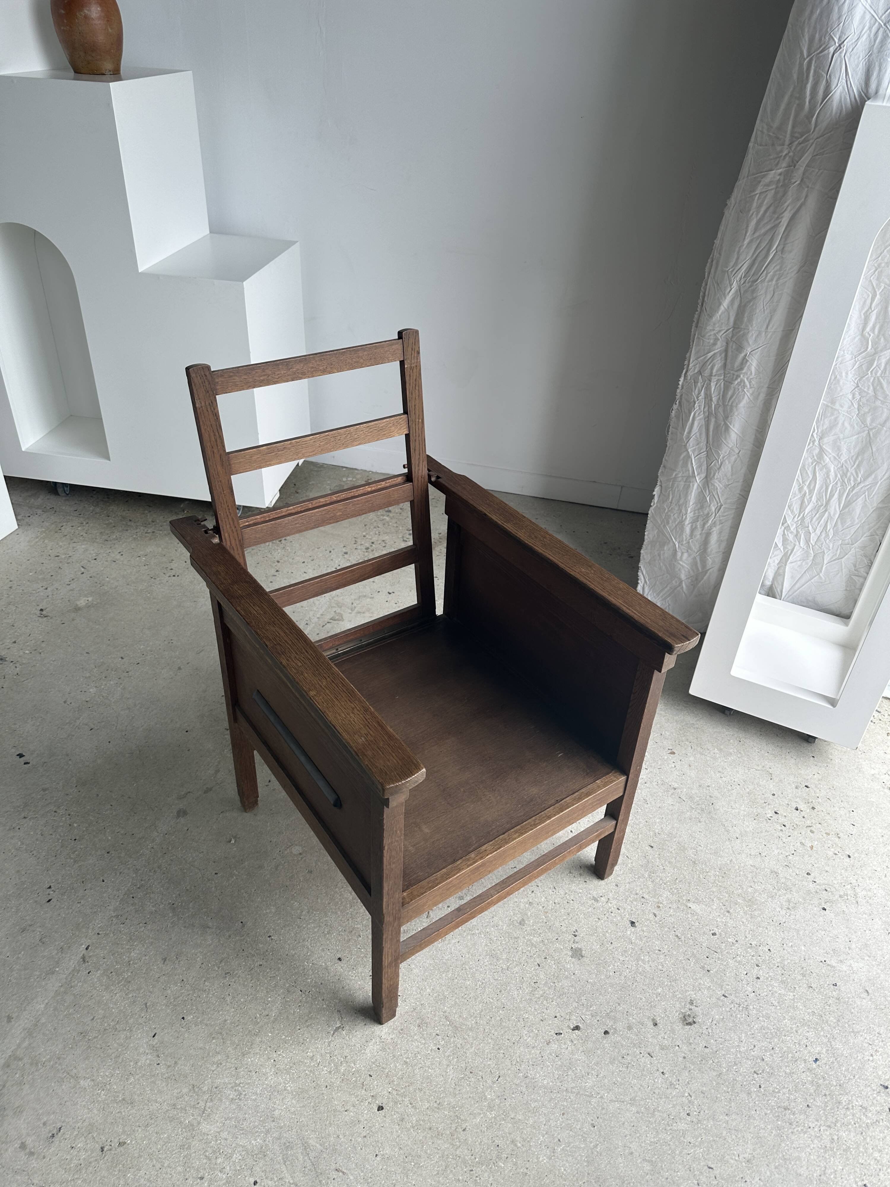 Large wooden armchair with adjustable reclining back