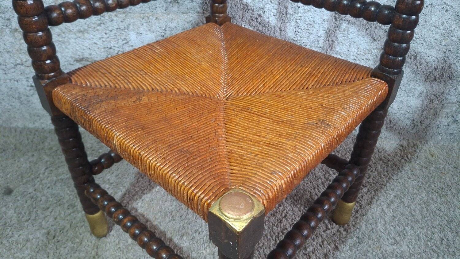 Fireplace corner chair in Louis XIII style, turned wood with braided rush, 19th century.