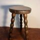 Round wooden tripod stool