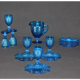 Old table set in blue pressed moulded glass
