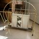 Vintage gold metal magazine rack from the 1960s.