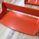 Space age wall coat rack, orange wood, with its shelf from the 1970s.