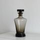Carafe, old smoked glass bottle with sculpted stopper.