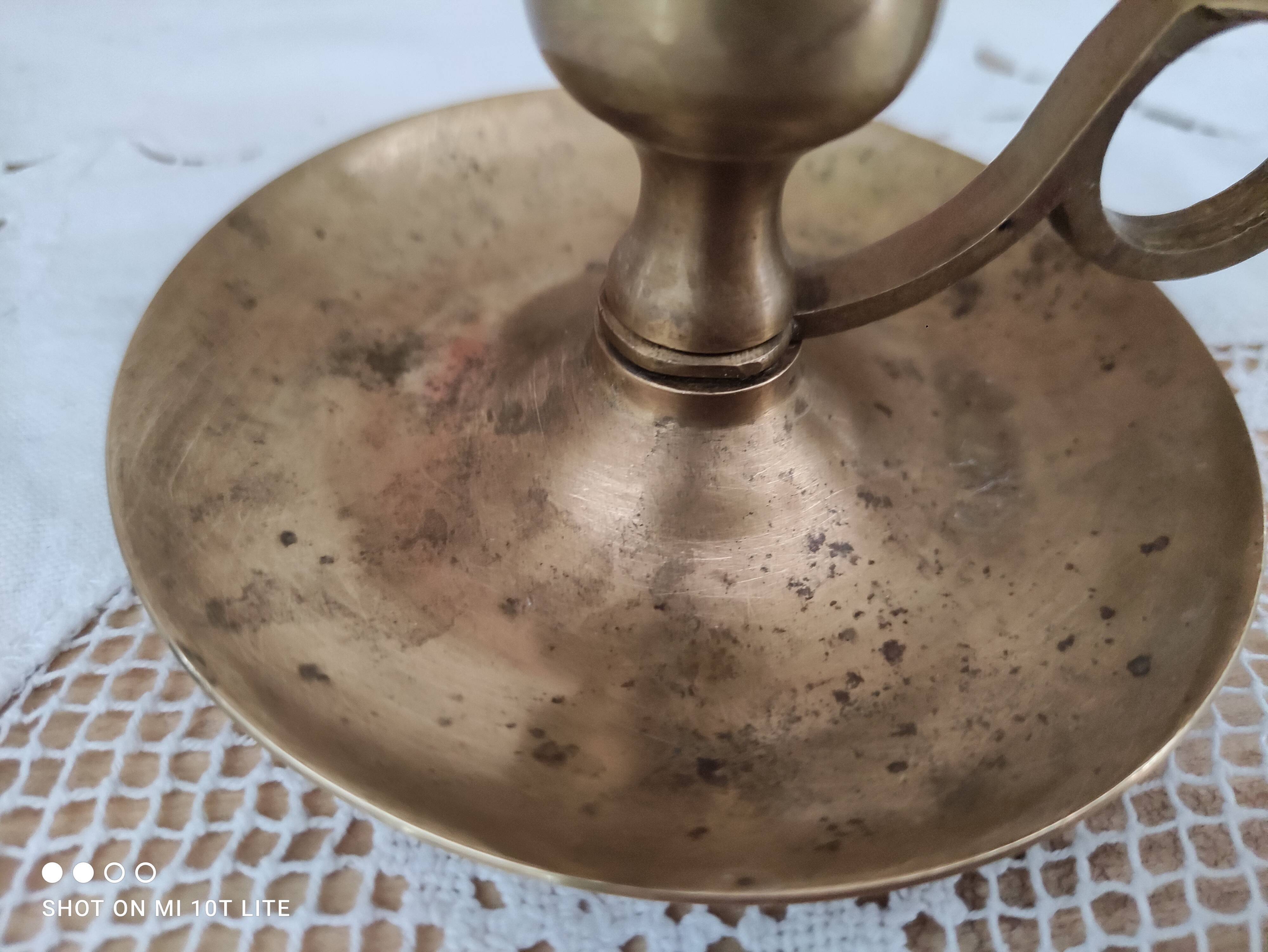 Hand candle holder called cellar rat in solid brass