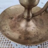 Hand candle holder called cellar rat in solid brass