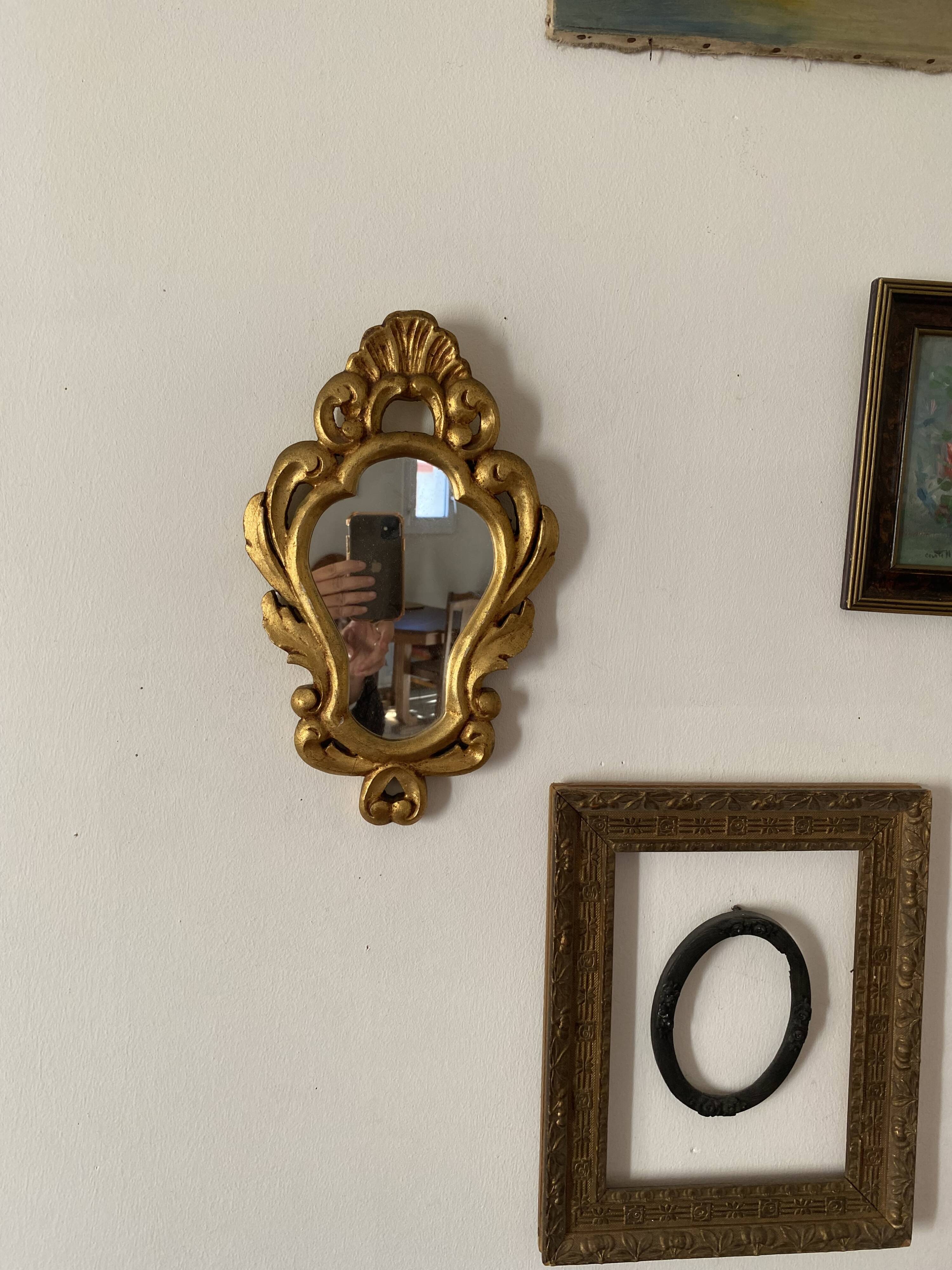 Golden mirror in baroque style.