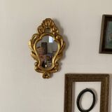 Golden mirror in baroque style.