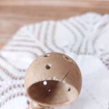 Old large vintage stoneware olive pot with its wooden spoon