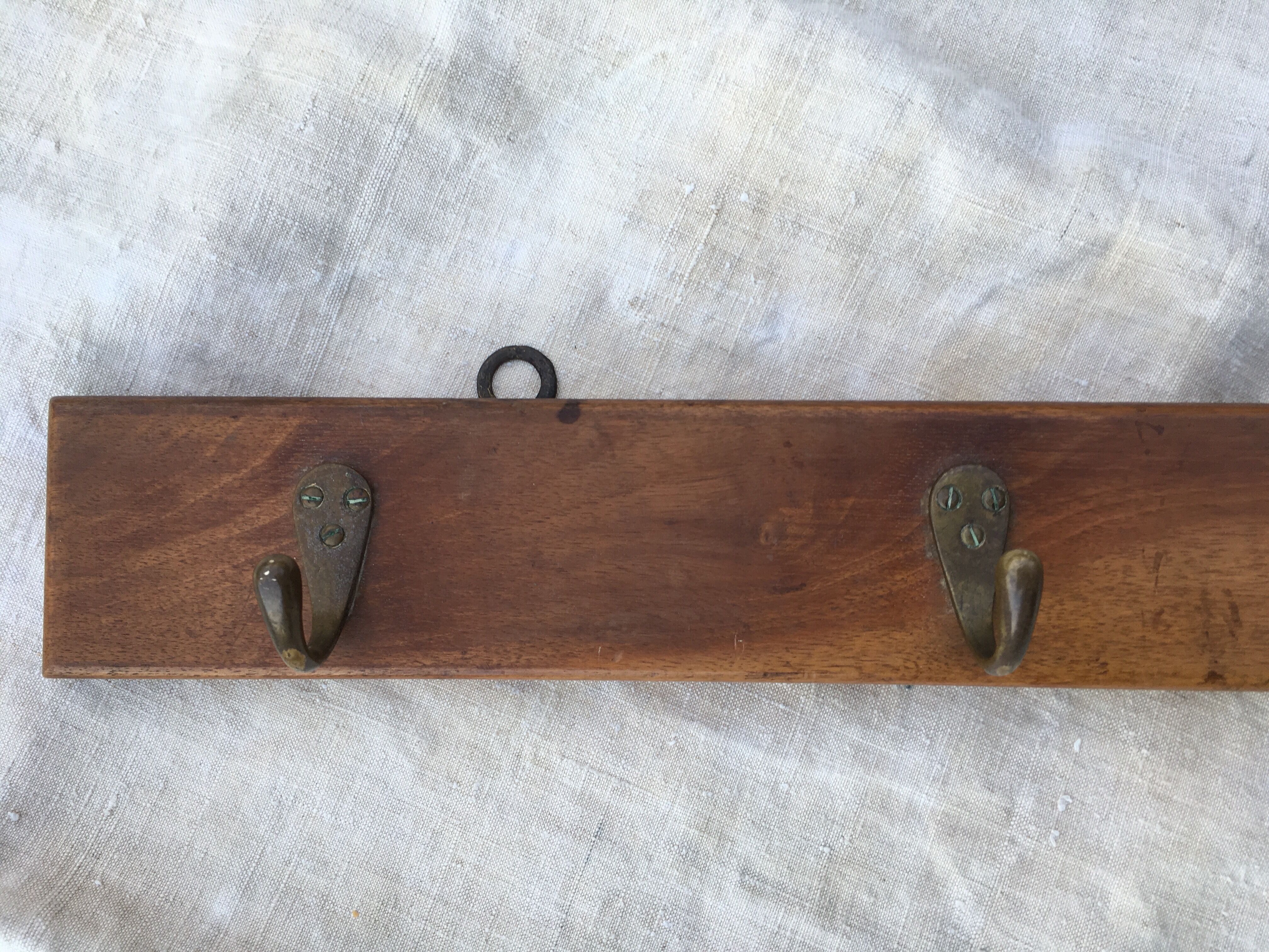 Wall hook from wood and brass