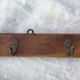 Wall hook from wood and brass