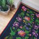 Handwoven summerish floral rug, black background with colorful delicate flowers 152x238cm