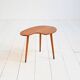 Biomorphic teak and brass side table from the 1950s–1960s