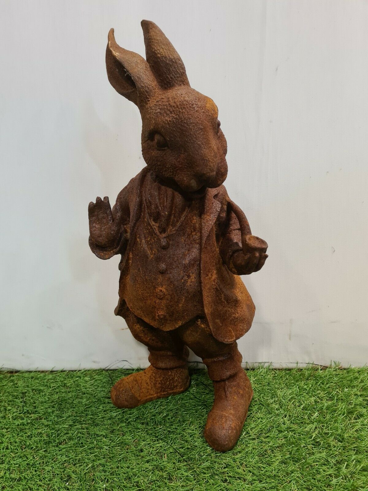 Rabbit with a cast iron pipe garden statue