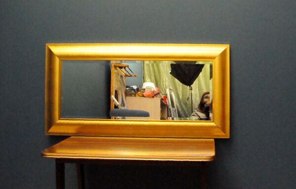 Large mirror in a golden decorative frame