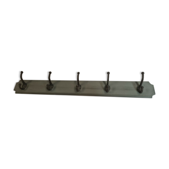 Wooden coat rack with cast iron hooks