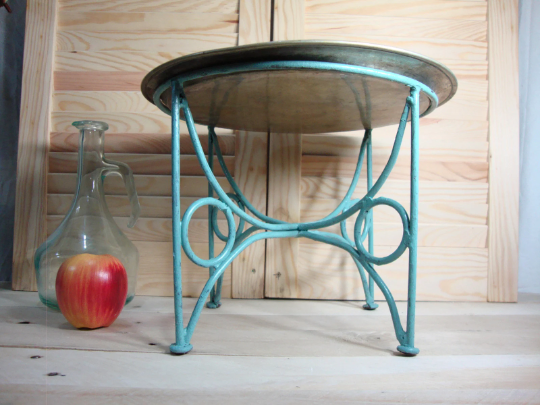 Small metal coffee table or plant stand.